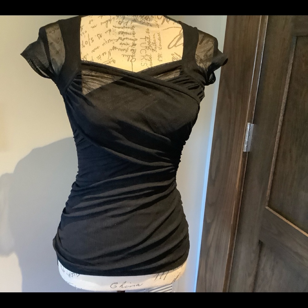 Black Criss Cross short sleeved top.